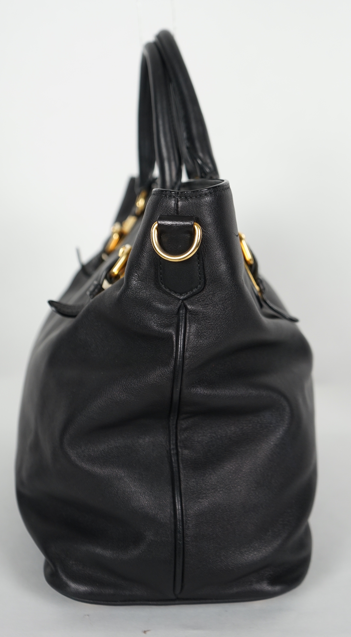 A Prada Vitello black leather bag with detachable strap, width 40cm, max heigh 27cm, depth 17cm